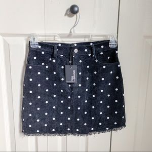 Black corduroy mini skirt w/ white polka dots